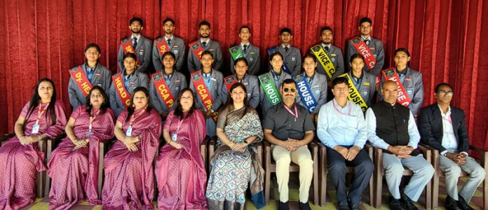 Newly appointed students cabinet posing with school management on Tuesday.