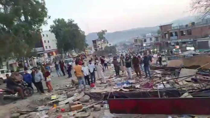 Illegal structures being removed during anti-encroachment drive near GMC Rajouri on Friday. -Excelsior/ Imran
