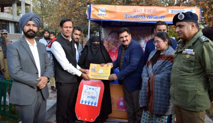 Principal Secretary PDD H Rajesh Prasad distributing LPG connections among beneficiaries on Tuesday.