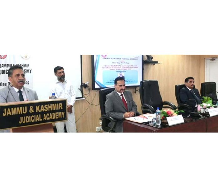 Justice Sanjeev Kumar addressing a workshop on Saturday.