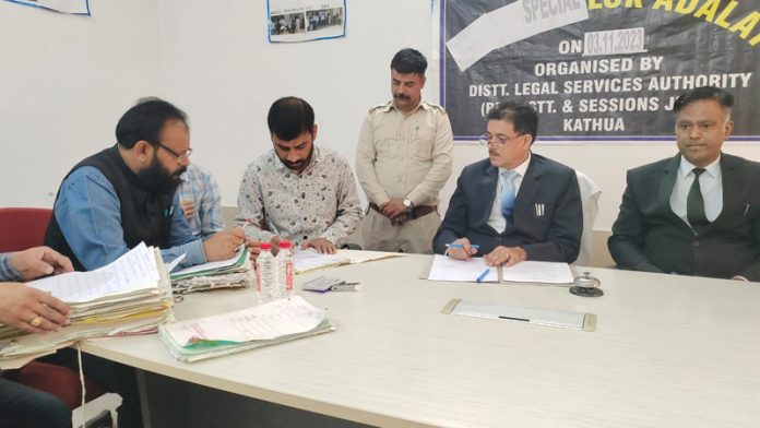 Cases being taken up for their settlement during a Special Lok Adalat in Kathua on Saturday. Cases being taken up for their settlement during a Special Lok Adalat in Kathua on Saturday.