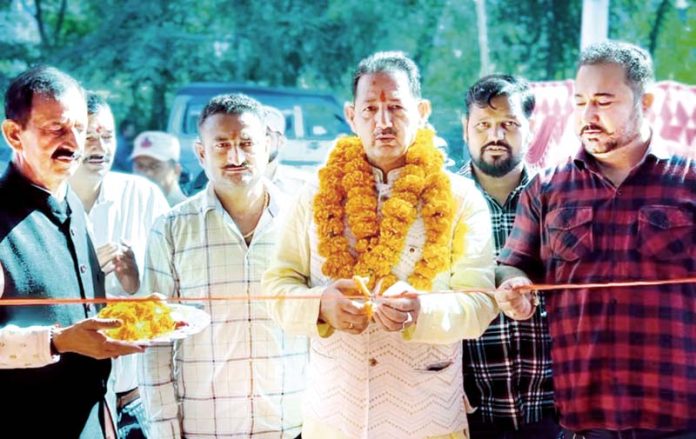 Former Deputy Mayor and BJP senior leader Baldev Singh Billawaria inaugurating a showroom in Jammu on Monday.