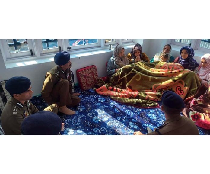 DGP RR Swain meeting family members of Ghulam Mohammad Dar at Wailoo, Kralpora in Baramulla district on Saturday.