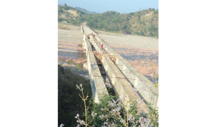 Brig over river Ujh abandoned by agency JKPCC near Barnoti in Kathua. -Excelsior/Pardeep Brig over river Ujh abandoned by agency JKPCC near Barnoti in Kathua. -Excelsior/Pardeep