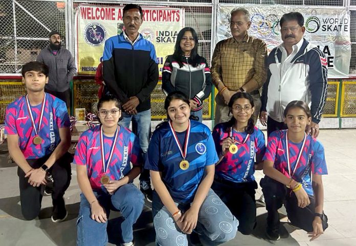 Kavinder Gupta, former Deputy Chief Minister posing with skaters in Jammu.