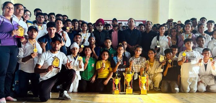 Players posing for group photograph during Ju-Jitsu Championship at Jammu.