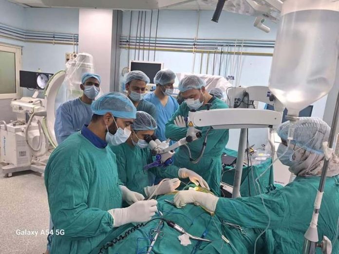 Doctors during a cochlear implant surgery on a patient at GMC Baramulla. -Excelsior/Aabid Nabi