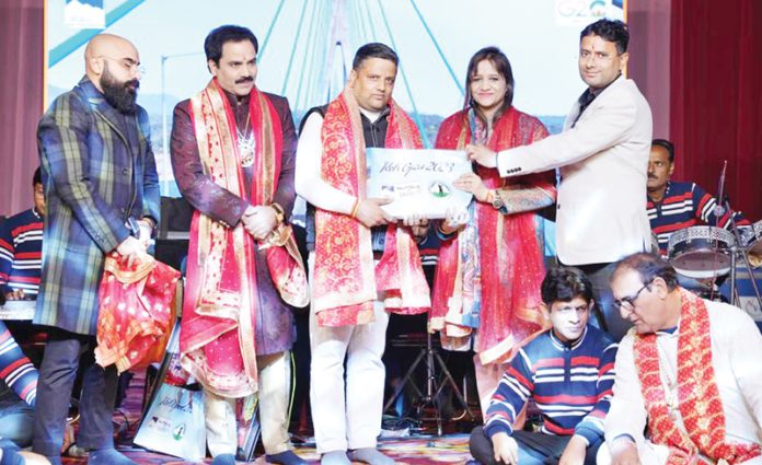 Sunaina Mehta, Joint Director Tourism felicitating the artists during Mata ki Chowki at Jhiri Mela. Sunaina Mehta, Joint Director Tourism felicitating the artists during Mata ki Chowki at Jhiri Mela.