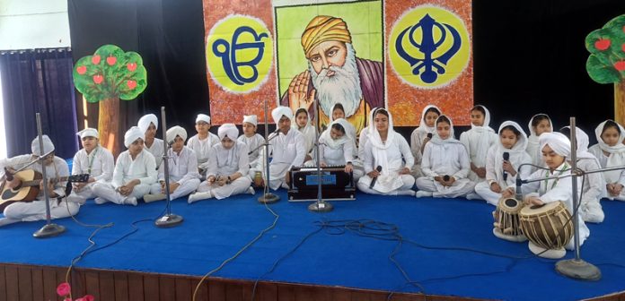Students of DPS singing 'Shabad Kirtan' during a Special Assembly on the birth anniversary of Guru Nanak Dev Ji.