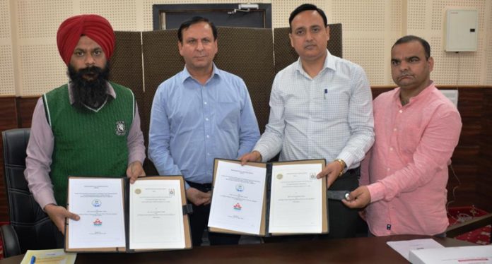 Principal of Govt Polytechnic Jammu and VC DAV University Jalandhar displaying copies of MoU signed between the two institutes. Principal of Govt Polytechnic Jammu and VC DAV University Jalandhar displaying copies of MoU signed between the two institutes.
