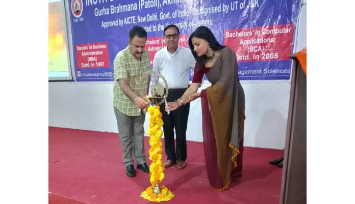 Chairman JGEI Vidhi Singh Jamwal and guest speaker Monika Mitter lighting ceremonial lamp to start a programme at IMS Jammu.