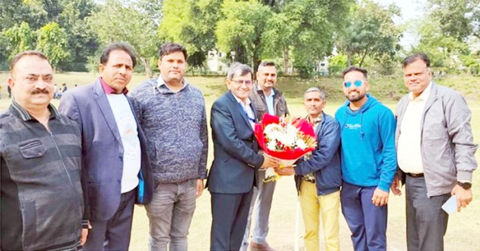 Chief guest posing with other officials at IIIM Jammu.