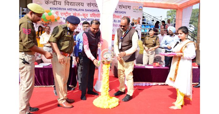 Div Com, Jammu Ramesh Kumar and IGP, Anand Jain lighting lamp during inaugural ceremony of 52nd National Sports Meet of KVS at Jammu. —Excelsior/Rakesh