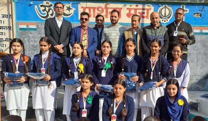 Students posing with trustees of Martyr captain Tushar Mahajan Memorial Trust at Udhampur.
