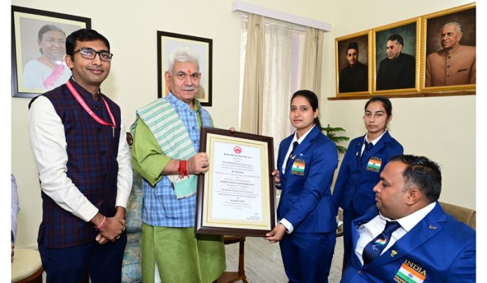 Lieutenant Governor Manoj Sinha presenting Certificate of Excellence Award to SMVDSB Para Archers On Wednesday. Lieutenant Governor Manoj Sinha presenting Certificate of Excellence Award to SMVDSB Para Archers On Wednesday.