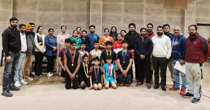 Gymnasts posing along with dignitaries at MA Stadium, Jammu.