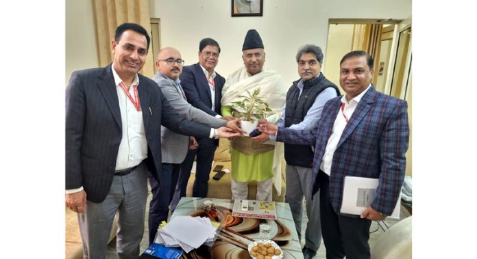 NHPC officials presenting a sapling to MP Gulam Ali Khatana before a meeting at Jammu. NHPC officials presenting a sapling to MP Gulam Ali Khatana before a meeting at Jammu.