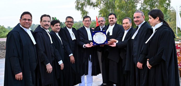 Chief Justice and other Judges of J&K and Ladakh HC presenting memento to Justice Mohan Lal at Jammu on Saturday. Chief Justice and other Judges of J&K and Ladakh HC presenting memento to Justice Mohan Lal at Jammu on Saturday.