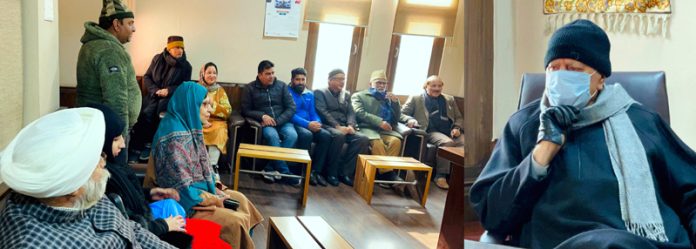 NC president Dr Farooq Abdullah interacting with party functionaries at Srinagar on Tuesday. NC president Dr Farooq Abdullah interacting with party functionaries at Srinagar on Tuesday.