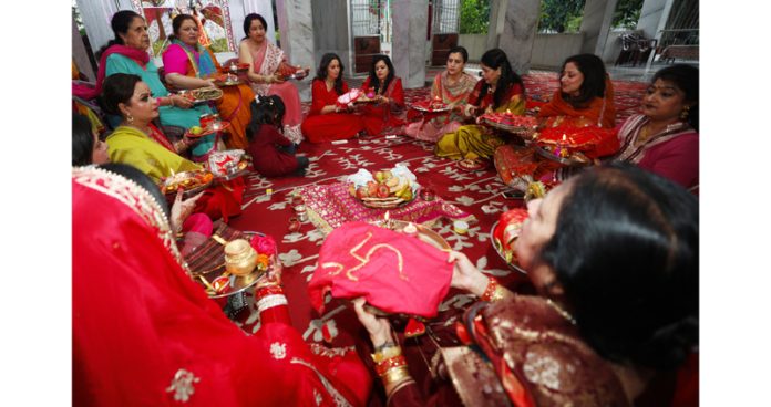 Women performing Karva Chauth rituals in Jammu on Wednesday. -Excelsior/Rakesh