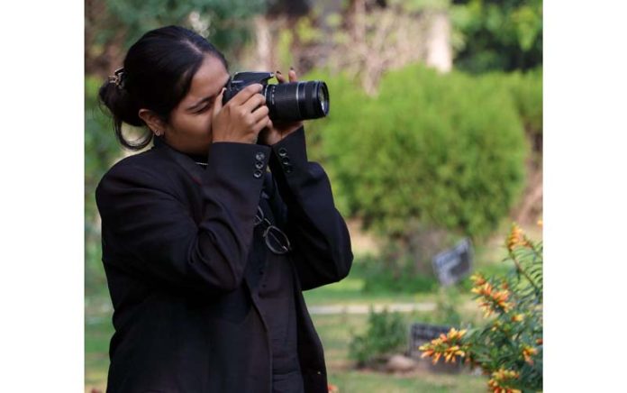 A participant shooting during Photography contest under Display Your Talent at JU on Thursday. -Excelsior/Rakesh