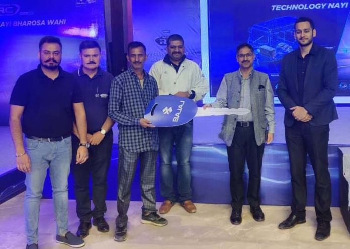 Executives of Bajaj Auto Ltd and New Style Fabricators along with others during the launch of passenger electric three-wheeler in Jammu. Executives of Bajaj Auto Ltd and New Style Fabricators along with others during the launch of passenger electric three-wheeler in Jammu.