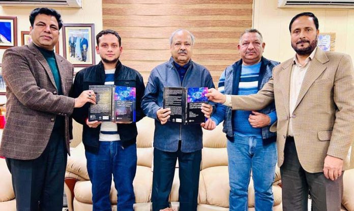 Vice-Chancellor of BGSBU and others releasing Shubam Mahajan's book on Friday.