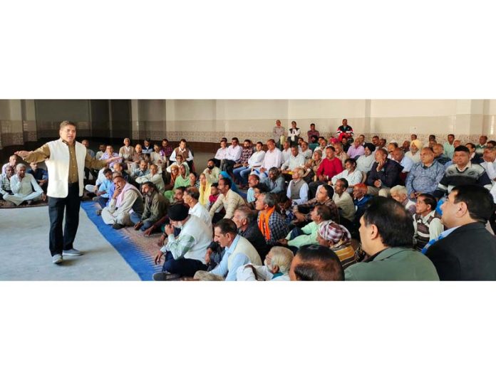 SOS International chairman Rajiv Chuni addressing a gathering of PoJK DPs at Nowshera.