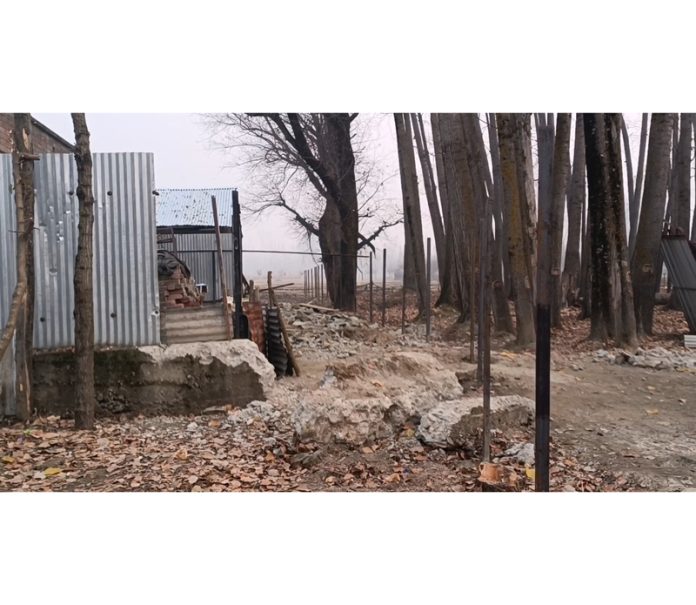 Iron bars installed on the state land in Haigam village of Sopore. -Excelsior/Aabid Nabi Iron bars installed on the state land in Haigam village of Sopore. -Excelsior/Aabid Nabi