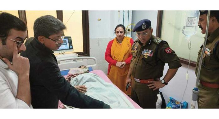 IGP Jammu, Anand Jain, interacting with an injured person at GMC Jammu on Friday.