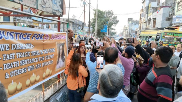 People staging protest at Talab Tillo, Jammu on Friday evening.