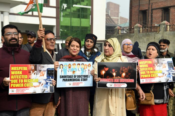 Congress workers and leaders marching towards MA Road Srinagar during protest. -Excelsior/Shakeel