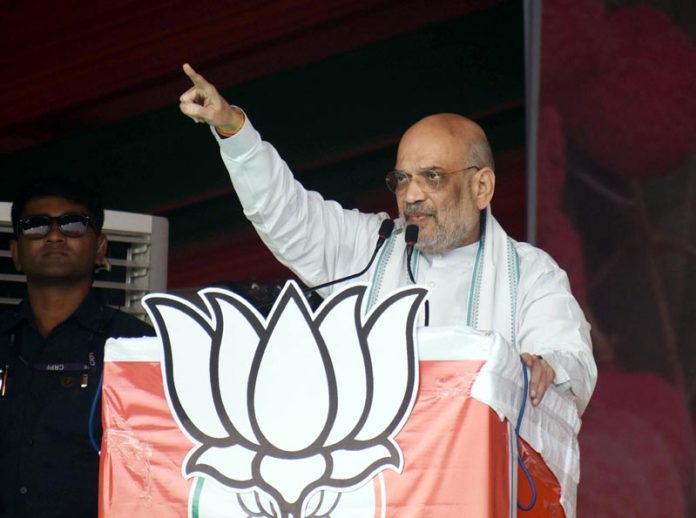 Union Home Minister Amit Shah addresses a public gathering during public meeting ahead of the Lok Sabha election 2024 in Muzaffarpur on Sunday. (UNI)