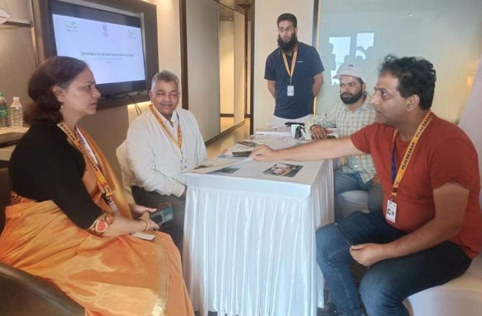Additional Secretary I&B interacting with the team of officers of DIPR at J&K Pavilion on Friday.