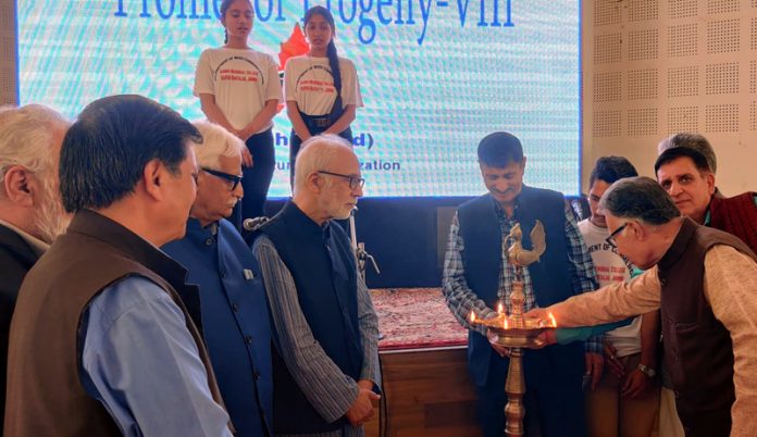 Dignitaries lighting the lamp during a function at Jammu on Thursday.