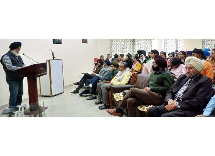 A dignitary delivering a lecture on Guru Nanak Dev’s 554th birth anniversary at Jammu University.