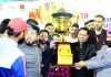 Players of J&K Football team and YSS officers posing with winner’s trophy.