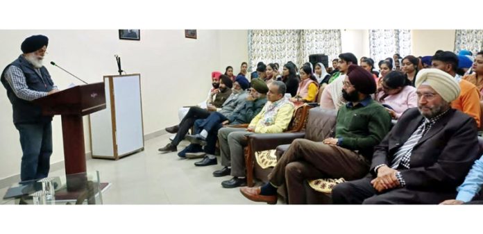 A dignitary delivering a lecture on Guru Nanak Dev’s 554th birth anniversary at Jammu University.