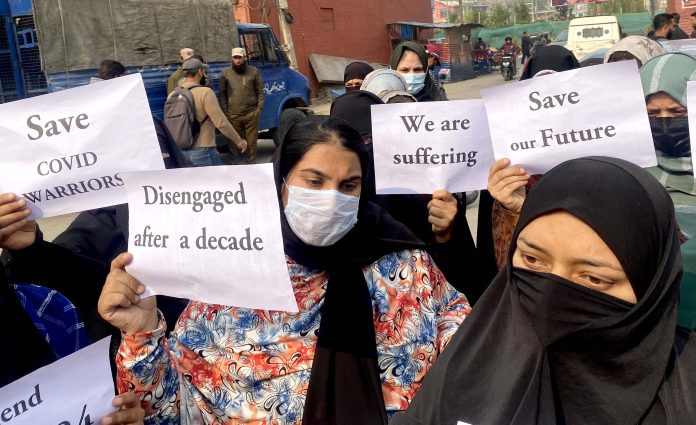 Paramedics associated with GMC Srinagar during a protest on Tuesday. -Excelsior/Shakeel