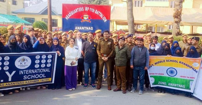 Police officers and the school students at the headquarters of IRP 11th Battalion in Anantnag.