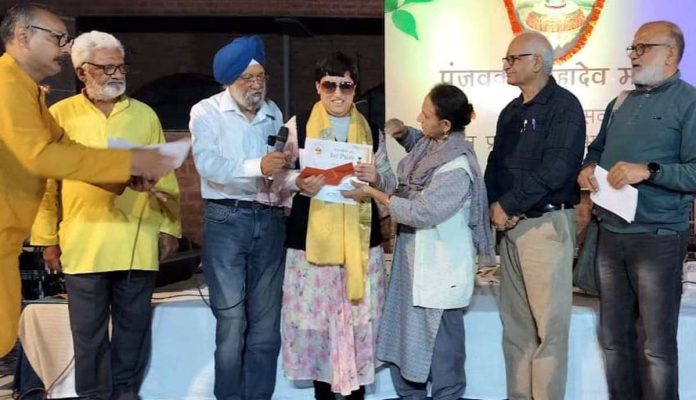 Winners of music contest being awarded at Panjvakter Mahadev Mandir in Jammu on Sunday.