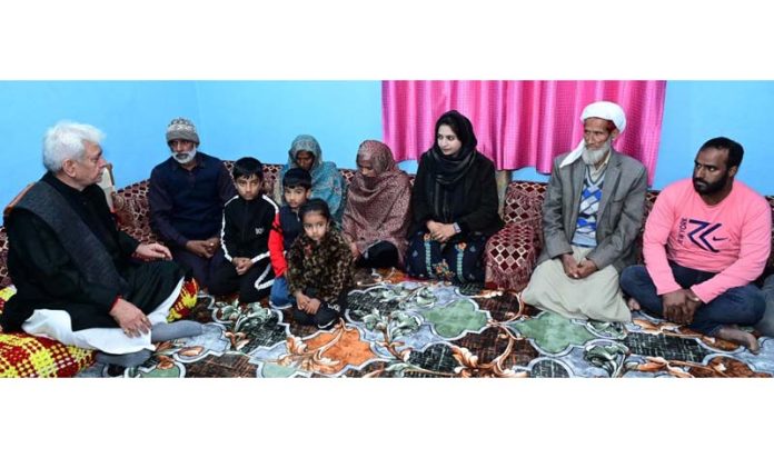LG Manoj Sinha meeting family members of martyr Abdul Majid at village Ajote in Poonch district on Saturday. LG Manoj Sinha meeting family members of martyr Abdul Majid at village Ajote in Poonch district on Saturday.
