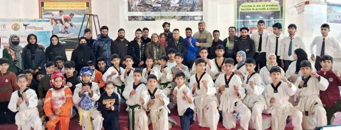 Taekwondo players posing during the closing ceremony of competition at Baramulla on Tuesday.