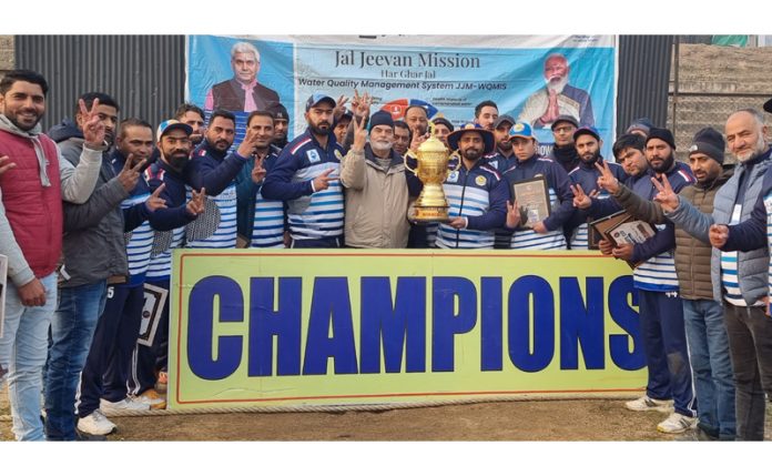 Jal Shakti Department receiving the trophy during the finals of the Corporate Cricket Cup at Jhelum Stadium in Baramulla. -Excelsior/Aabid Nabi