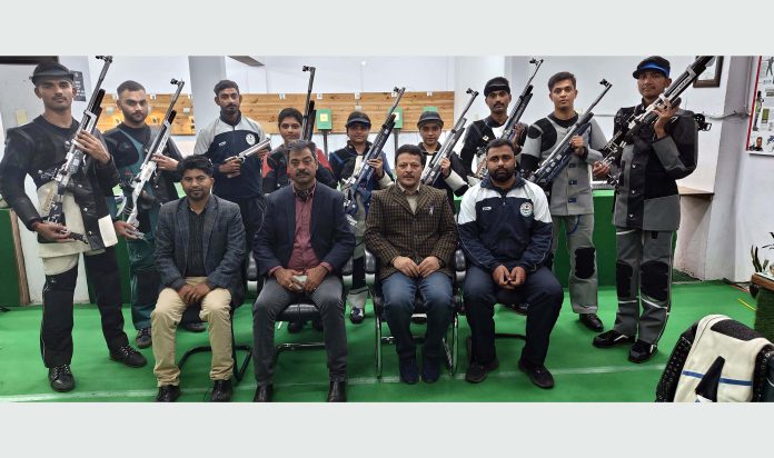 Dr Vinod Bakshi, Director Physical Education and Sports, Cluster University of Jammu posing with Shooters.