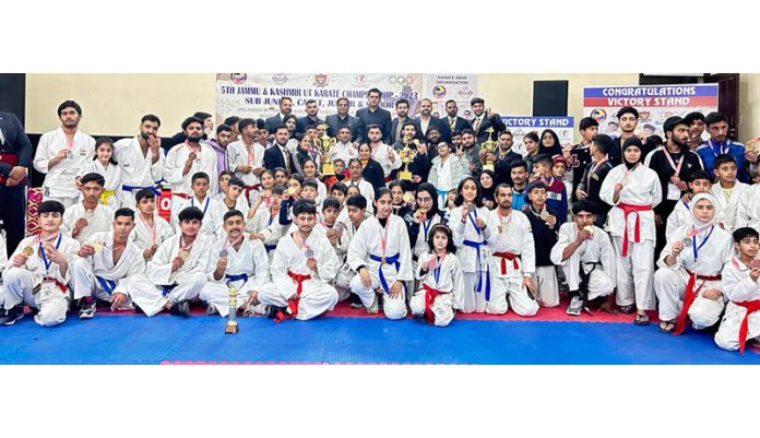 Karate players posing with dignitaries during the championship. Karate players posing with dignitaries during the championship.