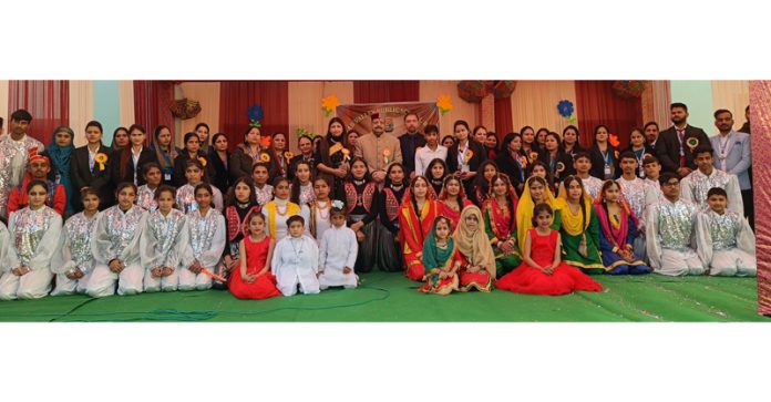 Senior BJP leader, Devender Singh Rana posing with students during Annual Day event of school.  