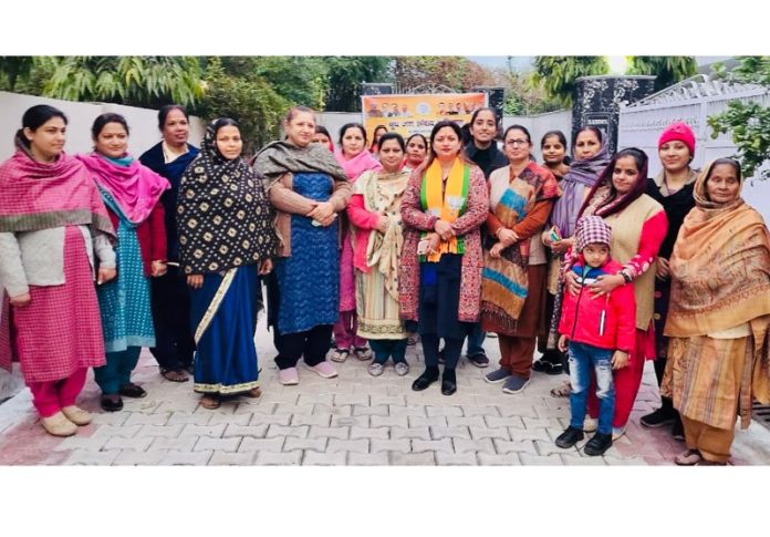 BJP president, Jammu South, Rekha Mahajan alongwith other party activists during a party programme in Cantonment area, Gandhi Nagar on Saturday.
