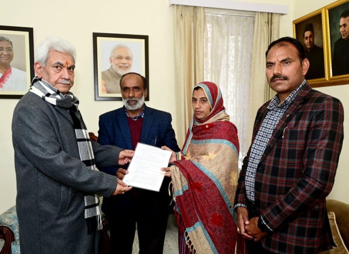 LG hands over appointment letter to wife of martyr Hav Abdul Majid LG hands over appointment letter to wife of martyr Hav Abdul Majid