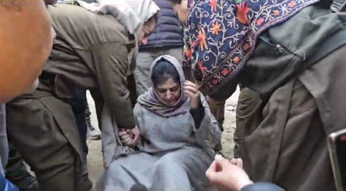 PDP president Mehbooba Mufti being removed from road while sitting on dharna near Bafliaz in Poonch on Saturday. -Excelsior/Waseem PDP president Mehbooba Mufti being removed from road while sitting on dharna near Bafliaz in Poonch on Saturday. -Excelsior/Waseem
